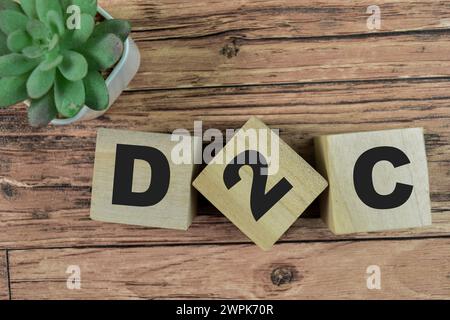Concept of The wooden Cubes with the word D2C - Direct to Consumer on wooden background. Stock Photo