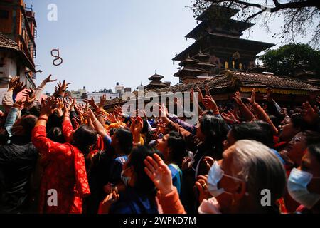 Kathmandu, Nepal. 08th Mar, 2024. Devotees chant prayers as milk is
