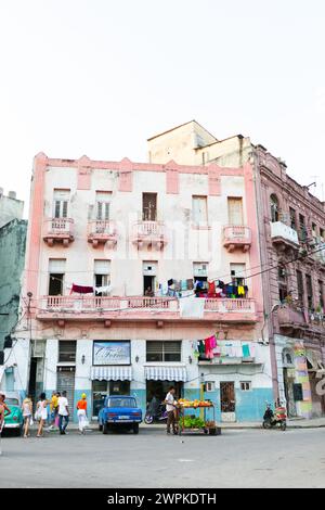 Pastel building with lively street life in Havana Cuba Stock Photo