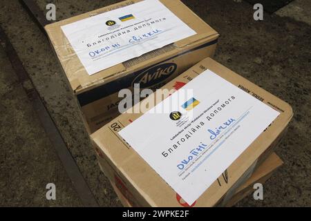 Non Exclusive: DNIPRO, UKRAINE - FEBRUARY 15, 2024 - Boxes of trench candles brought as part of charitable aid for Ukrainian military units by Latvian Stock Photo