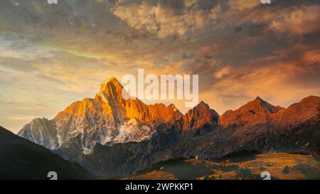 Dramatic sunset over mountain range silhouette Stock Photo