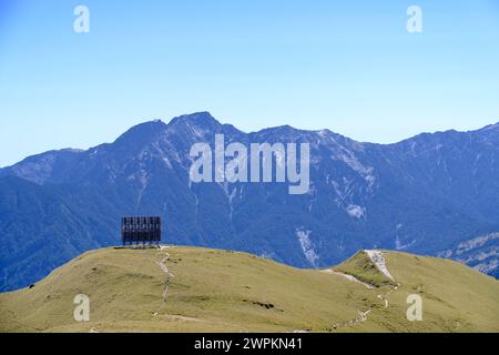 A lush hill overlooking the North Hehuan Mountains on a sunny day Stock Photo