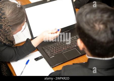Business project team working together in meeting room in office. Horizontal. Blurred background. Flames with laptop Stock Photo