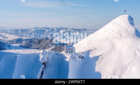 Church and cross on the descent from Mount Pilatus, Lake Lucerne, Switzerland, Europe Stock Photo