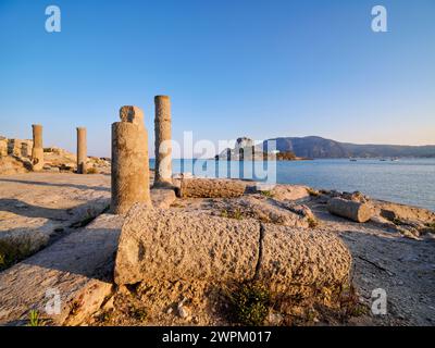 St. Stefanos Basilica Ruins and Kastri Island at sunset, Agios Stefanos Beach, Kos Island, Dodecanese, Greek Islands, Greece, Europe Stock Photo