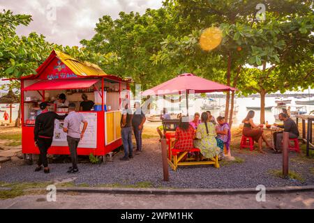 View of food stall in Grand Baie and boats in background, Grand Bay, Mauritius, Indian Ocean, Africa Stock Photo