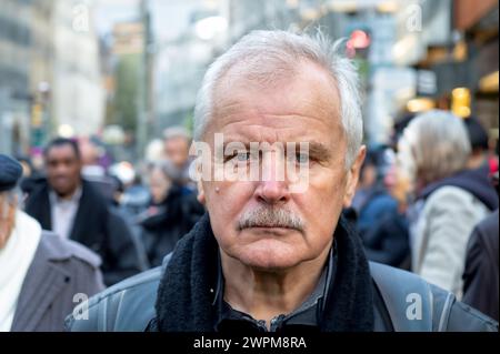 Portrait of senior citizen in a crowded street. Stock Photo