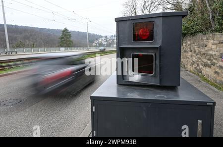 Stuttgart, Germany. 08th Mar, 2024. A car drives past a speed camera on an access road to Stuttgart city center. (Wipe effect due to long exposure) Credit: Bernd Weißbrod/dpa/Alamy Live News Stock Photo