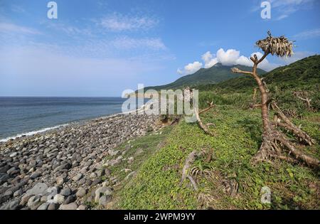 Batan, Philippines. Mar 8, 2024: Chadpidan Boulder Beach in Basco & Mount Iraya in Batanes, country's northernmost islands, nearest being 142 km away from southernmost point of Taiwan. PH Navy boost troops presence in strategically located islands with 119 new reservists + 76 recruits in training, an unpleasant deployment for Beijing accusing Manila of playing with fire. In 2023, Pres Marcos authorized American access to 4 other Philippine military bases (EDCA), 3 of them face Taiwan. PH & US militaries will conduct 2024 Balikatan naval exercise in Batanes. Credit: Kevin Izorce/Alamy Live News Stock Photo