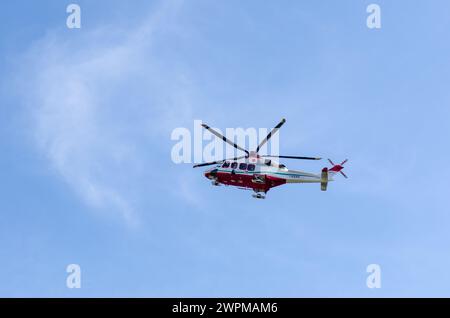 hospital emergency helicopter in flight, emergencies and rescue at any time of the day, crisis unit for the search and rescue of human lives. Turin It Stock Photo