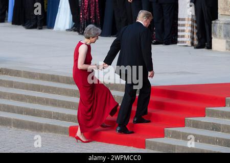 File photo dated 12/07/18 of the then prime minister Theresa May and the then US President Donald Trump taking her hand as they enter Blenheim Palace, Oxfordshire, where Mrs May hosted a dinner as part of his visit to the UK. Theresa May has said she will not fight the next general election, bringing a 27-year career in Parliament to an end. Issue date: Friday March 8, 2024. Stock Photo
