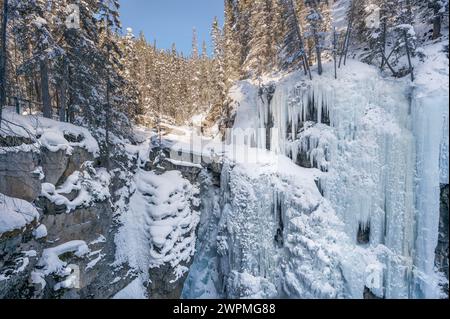 View of frozen Upper Falls at Johnston Canyon in Banff National Park, Alberta, Canada Stock Photo