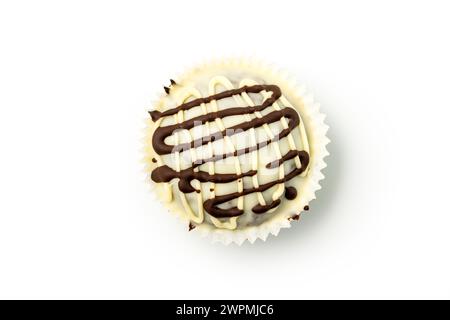 White Chocolate muffin with white dark chocolate glaze isolated on white background. Top view. Stock Photo