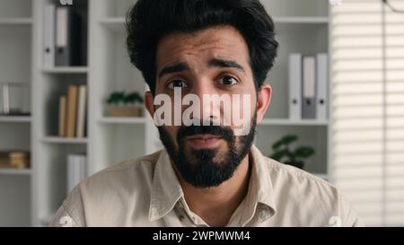 Webcam view Arabian Indian business man face ethnic businessman guy office worker talking video call online conference distant chat web camera male Stock Photo