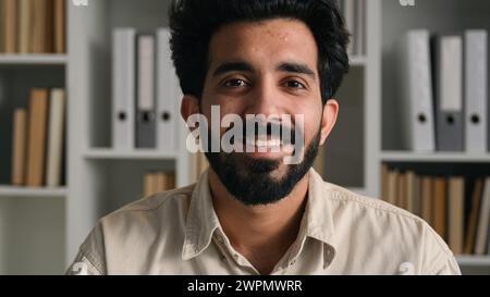 Indian muslim man Arabian bearded businessman guy freelancer executive ceo employer close up business portrait headshot happy male in office home Stock Photo