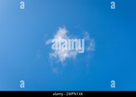 White single cloud against blue sky Stock Photo