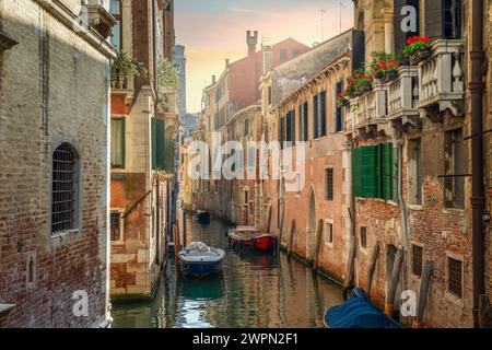 Canal in Venice between the old houses Stock Photo