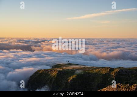Atmosphere at sunrise above the clouds, Miradouro do Pico do Areeiro, Madeira, Portugal, Europe Stock Photo