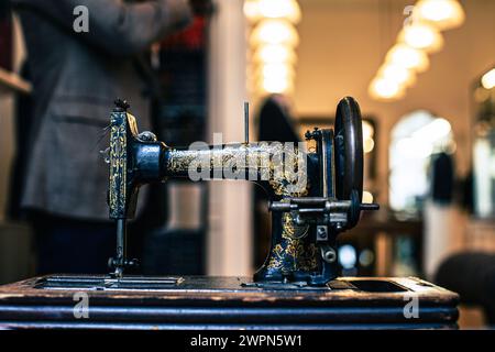 Vintage sewing machine on wooden tabel front view Stock Photo