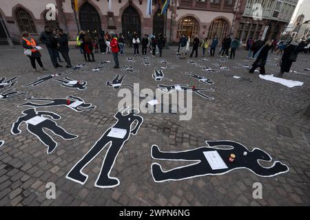 08 March 2024, Hesse, Frankfurt/Main: With the outlines of dead bodies, the 'Tatorte 2022' art campaign commemorates the 133 women who were killed as victims of femicide in Germany in 2022. The action takes place on the occasion of International Women's Day. Photo: Boris Roessler/dpa Stock Photo