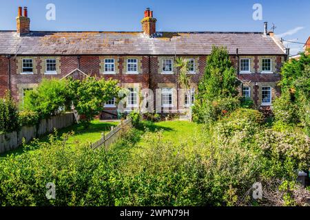 Typical terraced house with garden on Freshwater Bay, Freshwater, Isle of Wight, Hampshire, United Kingdom, England Stock Photo