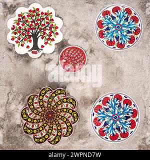 a beautiful artistic representation of the processing of Turkish ceramics applied to a road manhole Stock Photo