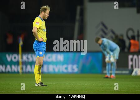 Brunswick, Germany. 08th Mar, 2024. Soccer: Bundesliga 2, Eintracht Braunschweig - Hansa Rostock, Matchday 25, Eintracht Stadium. Braunschweig's Sebastian Griesbeck (l) and Braunschweig goalkeeper Ron-Thorben Hoffmann stand on the pitch after the final whistle. Credit: Swen Pförtner/dpa - IMPORTANT NOTE: In accordance with the regulations of the DFL German Football League and the DFB German Football Association, it is prohibited to utilize or have utilized photographs taken in the stadium and/or of the match in the form of sequential images and/or video-like photo series./dpa/Alamy Live News Stock Photo