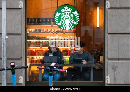 Madrid, Spain. 15th Jan, 2024. Customers drink and use laptops at the American multinational chain Starbucks Coffee store in Spain. (Credit Image: © Xavi Lopez/SOPA Images via ZUMA Press Wire) EDITORIAL USAGE ONLY! Not for Commercial USAGE! Stock Photo