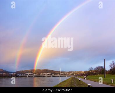 Linz, double rainbow over river Donau (Danube), way at Donaulände, bridge Eisenbahnbrücke, bridge VOEST-Brücke (behind) in Zentralraum, Oberösterreich, Upper Austria, Austria Stock Photo