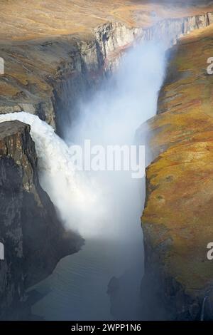 The artificial waterfall 'Hverfandi' at the Karahnjukastifla dam of the Karahnjukar power plant in north-east Iceland only falls into the gorge of the river 'Joekulsa a Bru' at maximum dam height. Stock Photo