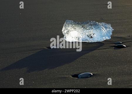 A chunk of ice washed up on 'Diamond Beach' in the south of Iceland. Stock Photo