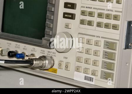 Electronics Spectrum Analyzer buttons and display, science and technology equipment partial with selective focus. Electronics testing concept image. Stock Photo