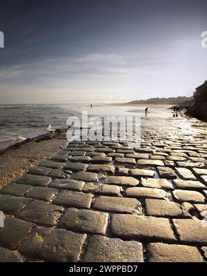 Contre Jour image of the Cobbled slipway at Bridlington and south beach access Stock Photo