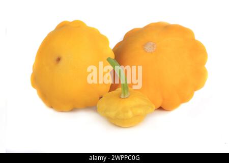 Three yellow bush pumpkins isolated on white background Stock Photo