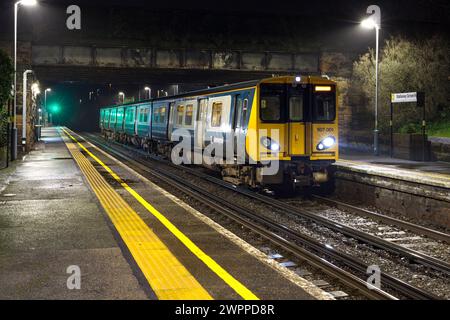 Merseyrail class 507 electric train 507001 calling at Wallasey Grove Road Railway station, on the Wirral line. Stock Photo