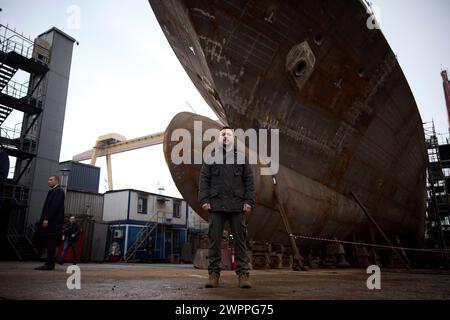 Istanbul, Turkey. 08th Mar, 2024. Ukrainian President Volodymyr Zelenskyy poses in front of the keel of an Ada-class anti-submarine corvette being built for the Ukrainian Navy at the Turkish STM shipyard, March 8, 2024 in Istanbul, Turkey. Credit: Ukraine Presidency/Ukrainian Presidential Press Office/Alamy Live News Stock Photo