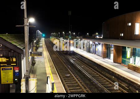 Merseyrail electrics class 507 third rail electric train 507017 at Ainsdale railway station, Southport, UK at night Stock Photo