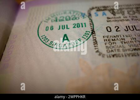Visa stamp, visum in a passport, shallow focus. Traveling and legal immigration concept. Stock Photo