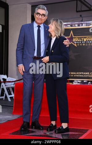 Hollywood, USA. 08th Mar, 2024. Deborah Divine (right) joins her husband Eugene Levy at his Star On The Hollywood Walk Of Fame Ceremony held in Hollywood, CA on March 8, 2024. (Photo By Sthanlee B. Mirador/Sipa USA) Credit: Sipa USA/Alamy Live News Stock Photo