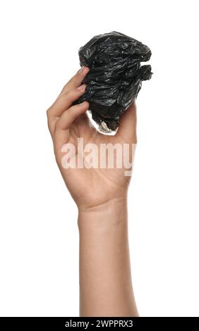 Woman holding crumpled plastic bag on white background, closeup Stock Photo