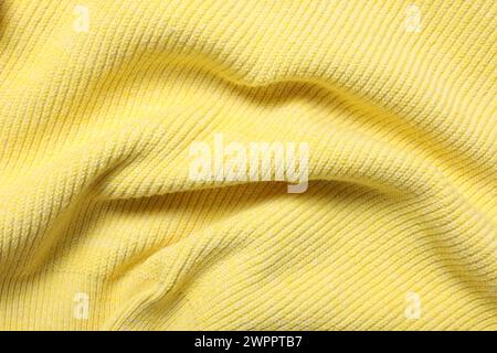 Texture of soft yellow fabric as background, top view Stock Photo