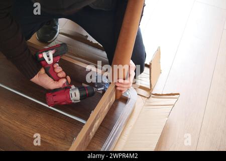 using electric drilling on wooden board  Stock Photo
