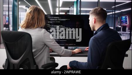 Computer Programmer Using Development Software On Laptop Stock Photo