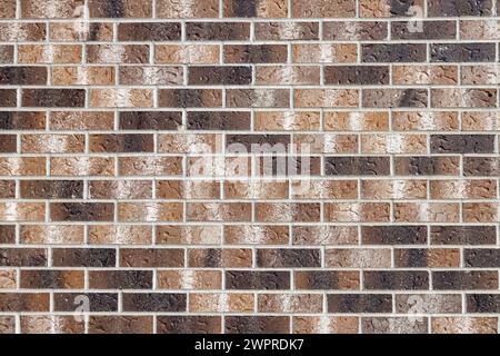 Full frame texture background of an attractive speckled brown and white modern brick wall in running bond pattern Stock Photo