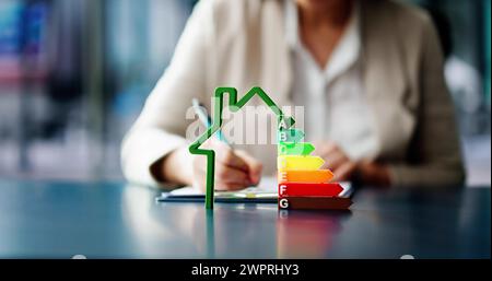 Energy Efficient House Audit Using Calculator. High Efficiency Stock Photo