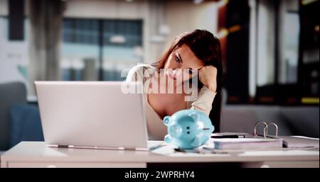 Young Worried Couple Looking At Calculator While Calculating Bills At Home Stock Photo