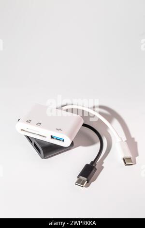 USB-C to USB 3.0 and SDMicroSD Card Reader Adapter. Connect devices to computer. Easily connect USB devices, SD cards, and microSD cards to laptop, ta Stock Photo