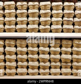 Boxes of 6 Free Range eggs stacked on a Supermarket shelf for sale in Sprowston, Norfolk, England, United Kingdom. Stock Photo