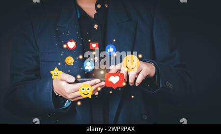 Social media and digital online concept, man using smart phone on sofa at home. The concept of living on vacation and playing social media. Stock Photo