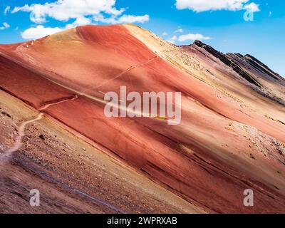 Amazing colors of the Red Valley (valle rojo) with stunning path leading to the top of the mountain, Cusco region, Peru Stock Photo